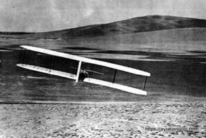 Wilbur Wright making right run in glide from West Hill, Oct. 24, 1902 with Kill Devil Hill in background